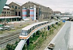 Monorail train passing Powerhouse Museum with goods line and Pyrmont Power Station visible thumbnail